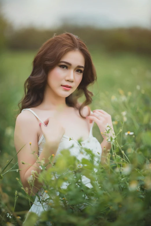 a woman in a white dress standing in a field, a picture, by Basuki Abdullah, 8k artgerm bokeh, square, 8 k ), “ sensual