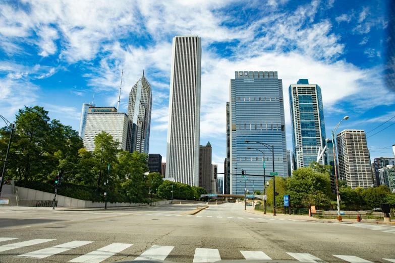 a city street filled with lots of tall buildings, by Matthew D. Wilson, pexels contest winner, chicago skyline, calatrava, deserted, bright sunny day