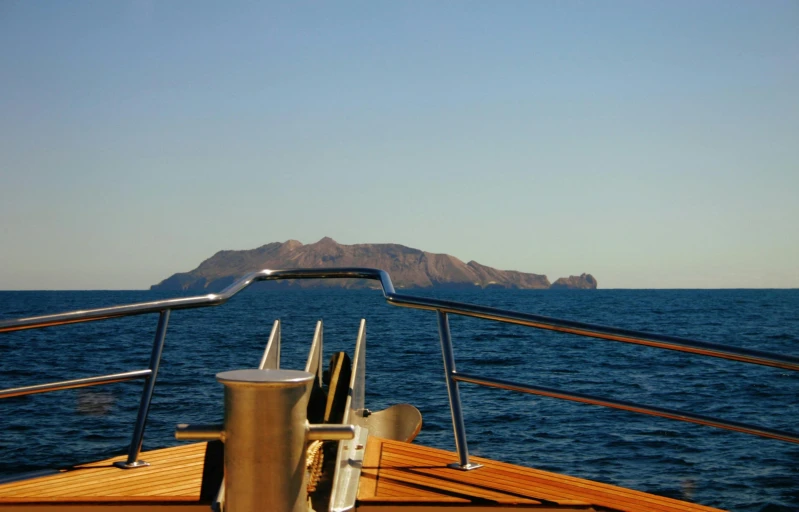 a view of an island from the back of a boat, a picture, by Simon Marmion, costa blanca, on a super yacht, piroca, seaview