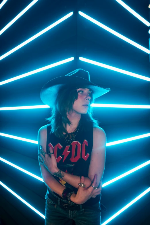 a man standing in front of neon lights, a portrait, cow-girl, androgynous face, official photo, temples