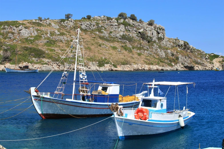 a couple of boats that are in the water, pexels contest winner, hurufiyya, aphrodite, fish seafood markets, avatar image