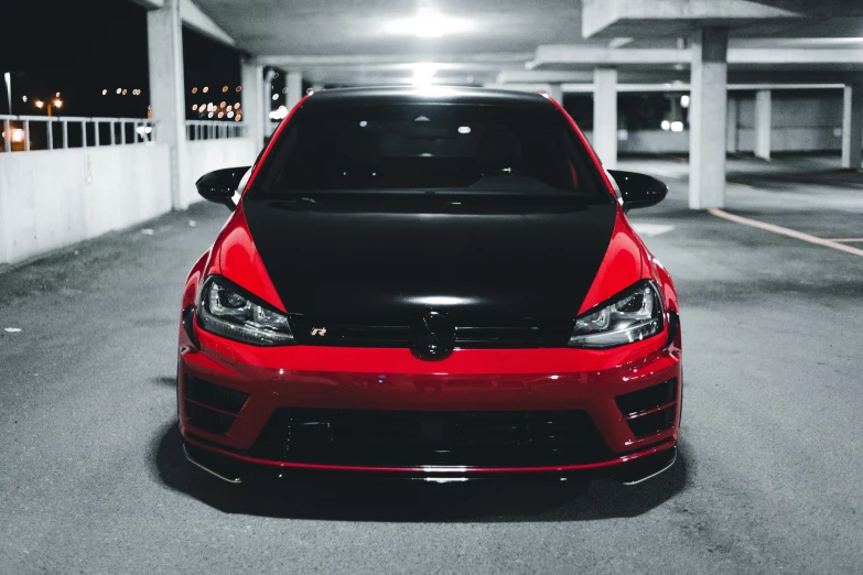 a red car parked in a parking garage, by Adam Rex, pexels contest winner, black and red armor, wrx golf, full front view, instagram post
