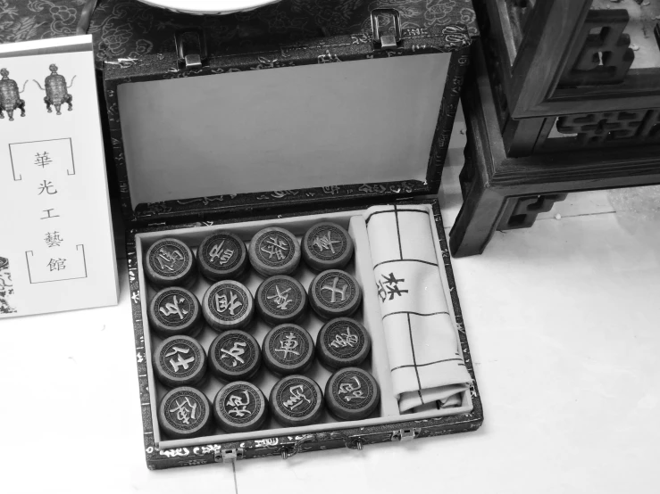 a black and white photo of a box of typewriters, an engraving, by Wang Yi, dau-al-set, game case, ancient runes, photo taken in 2 0 2 0, pills