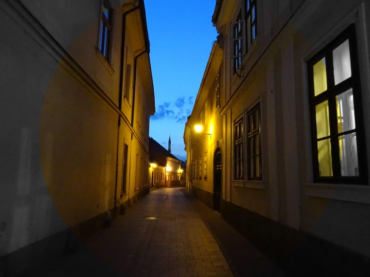 a couple of buildings that are next to each other, by Adam Szentpétery, pexels contest winner, in an alley at night back lit, capital of estonia, profile image, calm evening