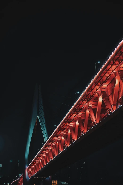 a bridge over a body of water at night, by Jacob Toorenvliet, pexels contest winner, red neon details, red trusses, pewdiepie selfie at a bridge, low detail