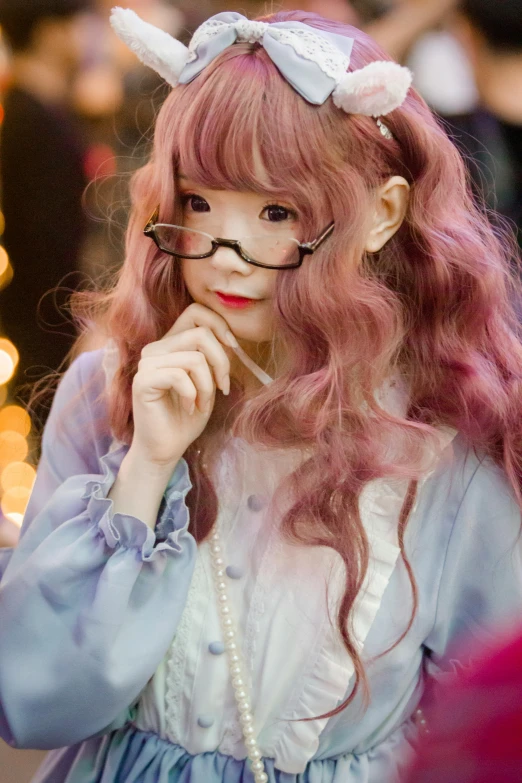 a close up of a person wearing a costume, by Ayami Kojima, reddit, rococo, wearing small round glasses, fairycore, wavy hair spread out, ((pink))