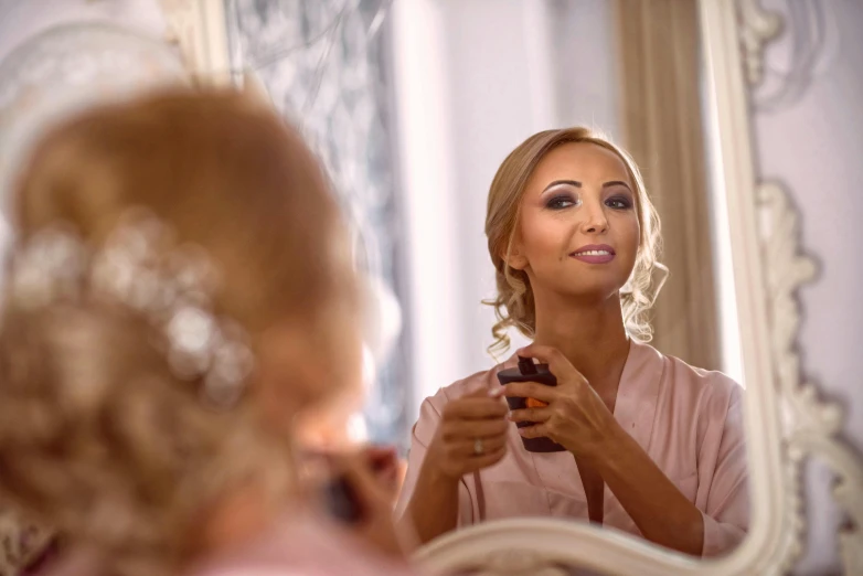 a woman that is standing in front of a mirror, with professional makeup, sofya emelenko, beautiful surroundings, amanda lilleston