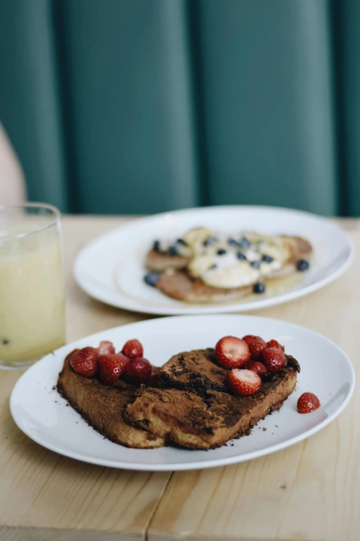 a close up of two plates of food on a table, unsplash, toast, chocolate, milk, a blond