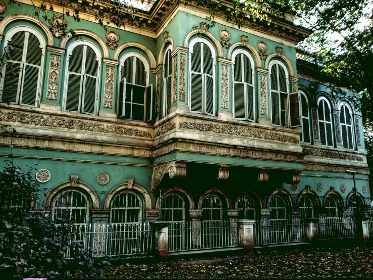 a large green building with lots of windows, a colorized photo, inspired by Elsa Bleda, pexels contest winner, baroque, old abandoned house, decorated with russian motifs, 1990's photo, square