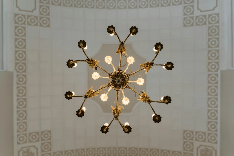 a chandelier hanging from the ceiling of a building, inspired by Anna Füssli, art nouveau, national archives, cybermosque interior, evenly lit, white ceiling