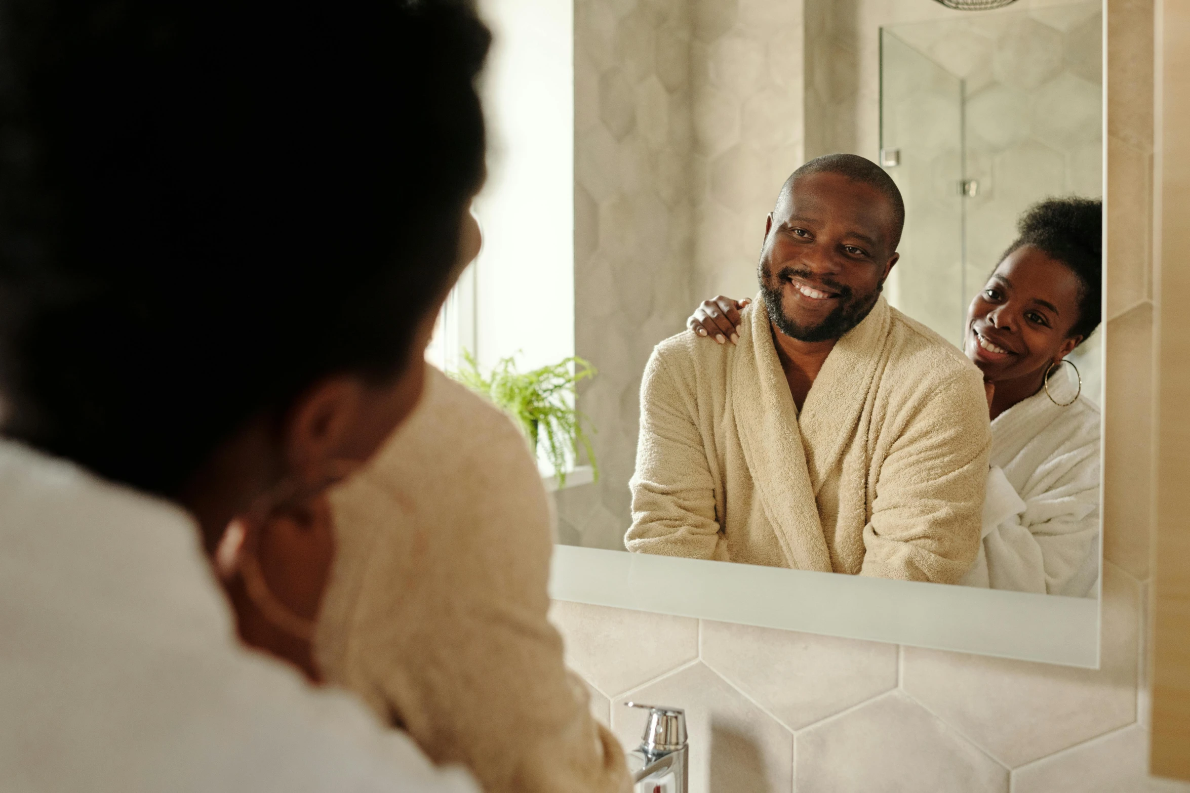 a man and woman standing in front of a bathroom mirror, pexels contest winner, renaissance, brown skin man with a giant grin, caring fatherly wide forehead, two men hugging, skincare