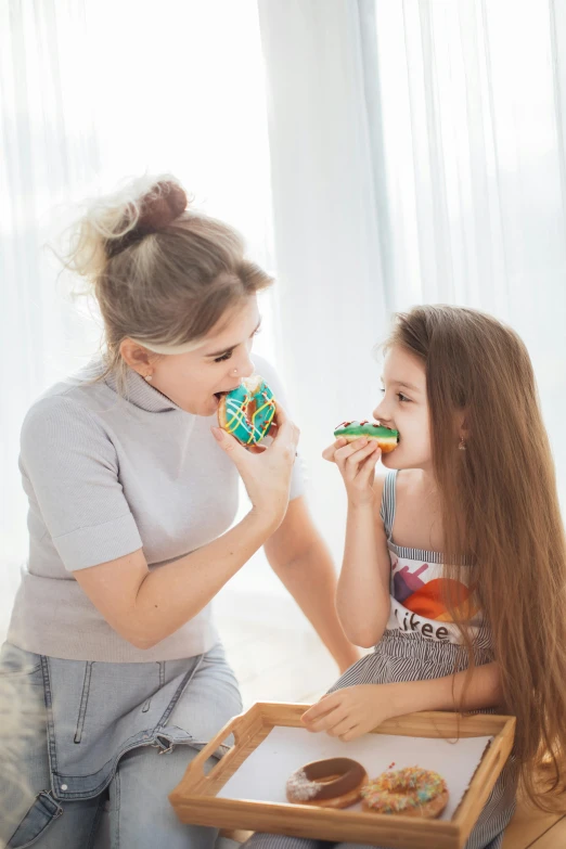 a mother and daughter sitting on the floor eating donuts, pexels contest winner, pop art, cute bandaid on nose!!, emerald, vocal tract model, ekaterina