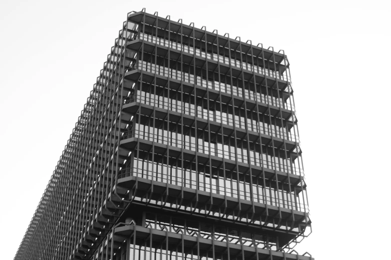 a black and white photo of a tall building, by Jan Wijnants, unsplash, brutalism, honeycomb structure, square, highly detailed!!, office building