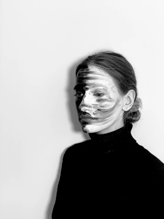 a woman with white paint on her face, a black and white photo, inspired by Anna Füssli, stripe over eye, saatchi art, ewa juszkiewicz, face mask