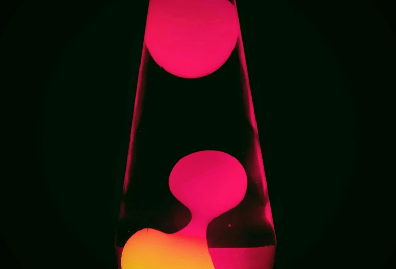 a lava lamp sitting on top of a table, an abstract sculpture, flickr, conceptual art, colored gel lighting, 1960s color photograph, the cytoplasm”, color”