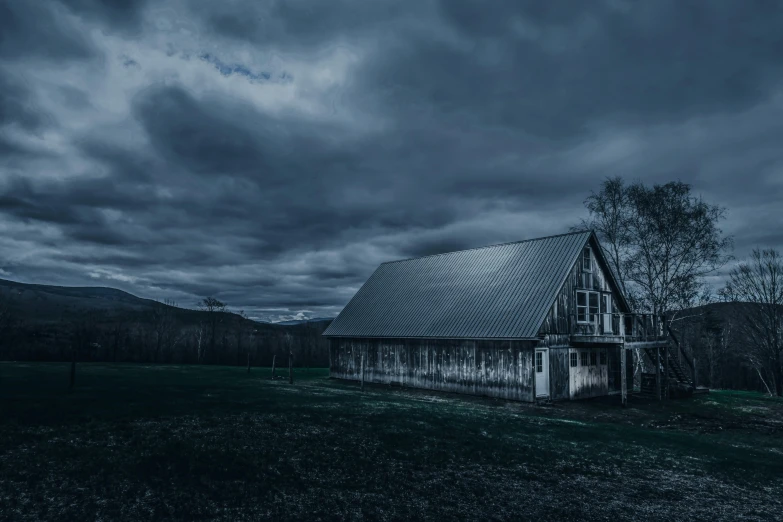 a barn in the middle of a field under a cloudy sky, inspired by Gregory Crewdson, pexels contest winner, renaissance, dark winter evening, grey, (night), today\'s featured photograph 4k