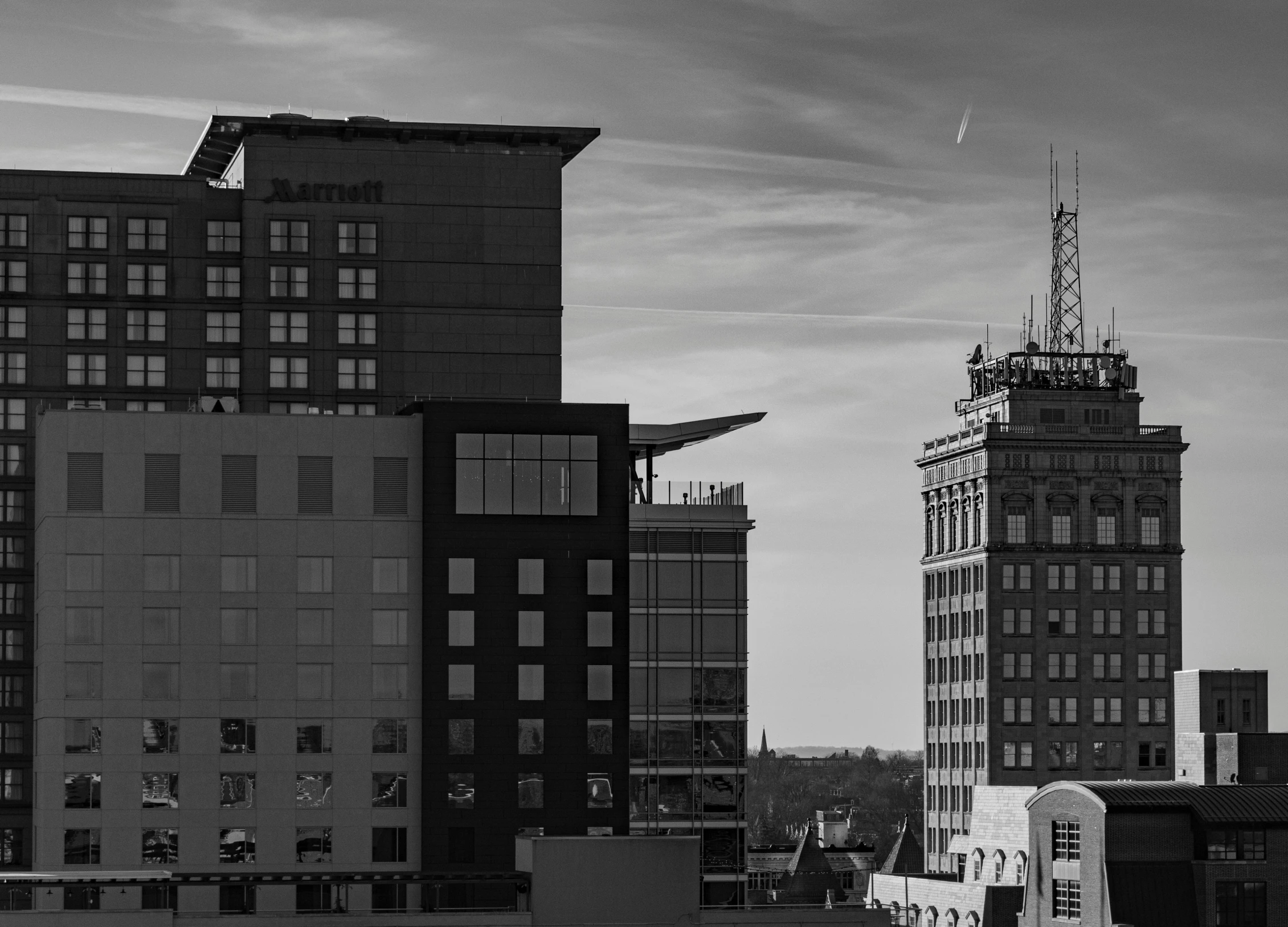 a black and white photo of a city, by Mike Bierek, chesterfield, buildings are flying, square, header