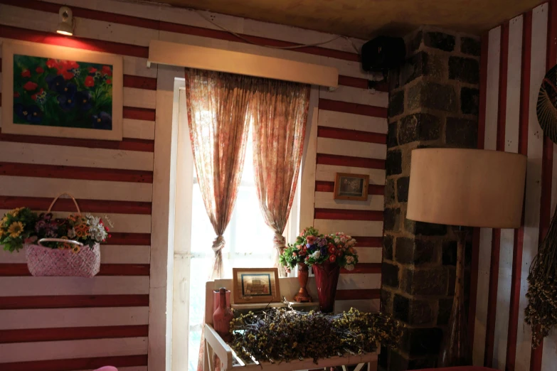 a bed sitting in a bedroom next to a window, red curtain, traditional corsican, garis edelweiss, home display