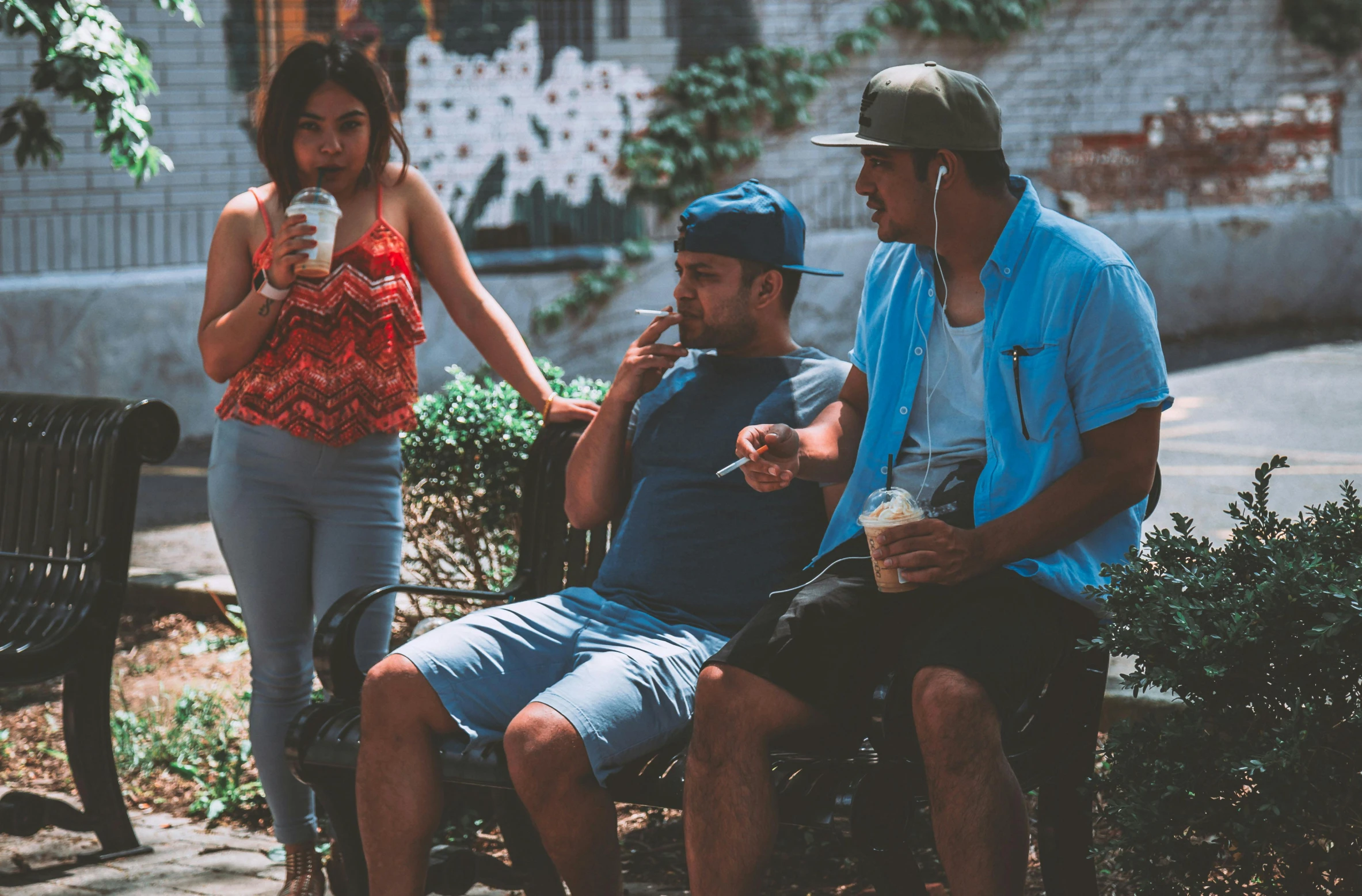 a group of people sitting on a park bench, pexels contest winner, happening, bra and shorts streetwear, chewing tobacco, avatar image