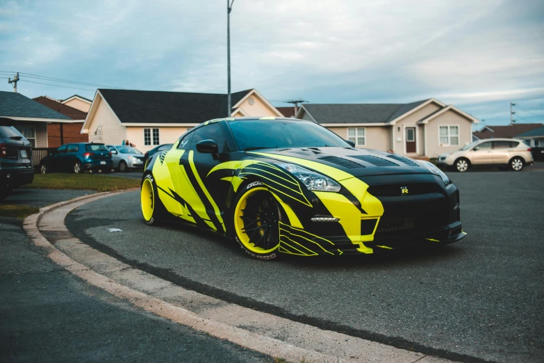 a yellow and black sports car parked in front of a house, by An Gyeon, pexels contest winner, hyperrealism, samurai vinyl wrap, 8 k highly detailed ❤🔥 🔥 💀 🤖 🚀, profile picture 1024px, drifting