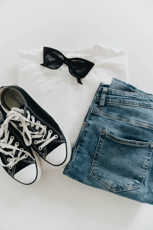 a pair of black sneakers, jeans and a white t - shirt, trending on pexels, bra and shorts streetwear, zoomed out, holiday, snacks