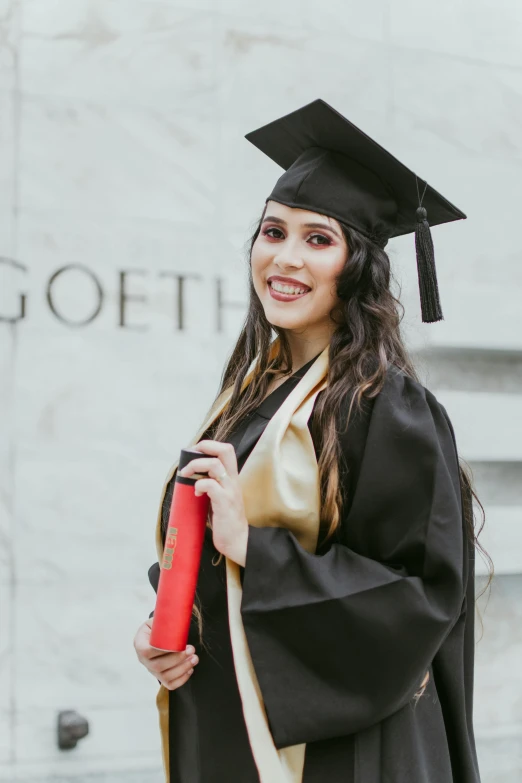 a woman in a graduation gown holding a diploma, reddit, promo photo, leather robes, female with long black hair, 2019 trending photo