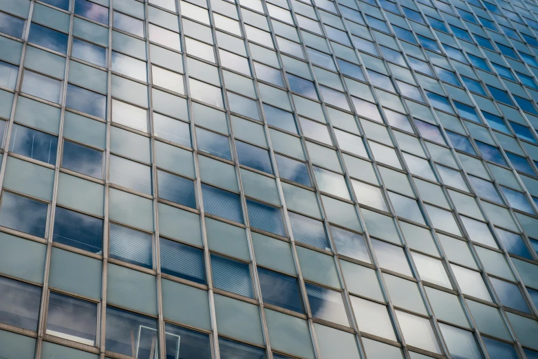 a very tall building with a lot of windows, inspired by Richard Wilson, unsplash, square lines, medium closeup, fan favorite, 8k resolution”