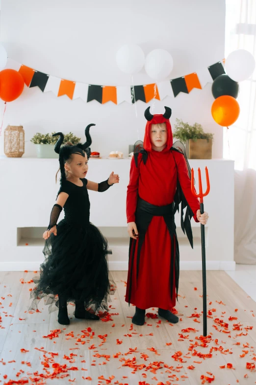 two little girls dressed up in halloween costumes, pexels, international gothic, long tail with horns, imp, boys, beistle halloween decor