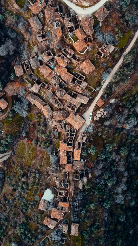 an aerial view of a village in the mountains, by Carlo Martini, pexels contest winner, conceptual art, traditional corsican, photogrammetry, thumbnail, brown