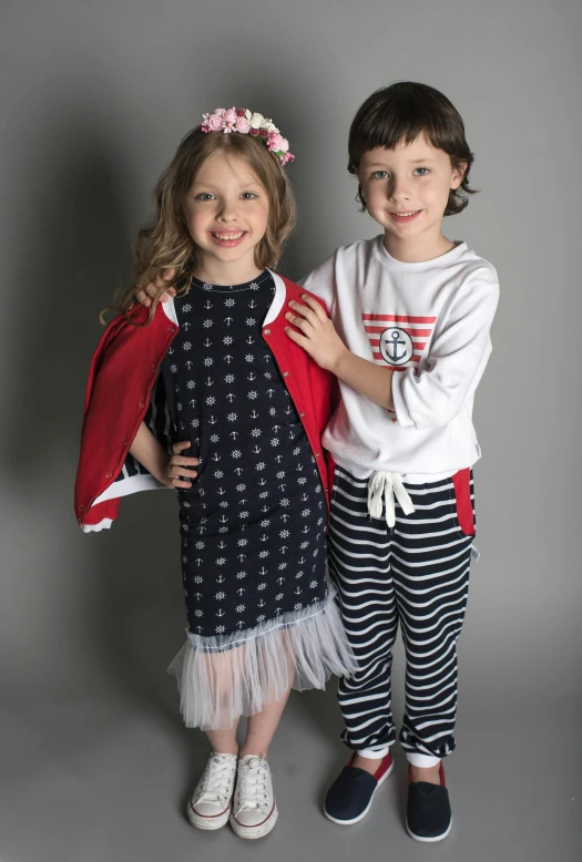 a couple of kids standing next to each other, at a fashion shoot, sailor clothing, promo photo, portrait image