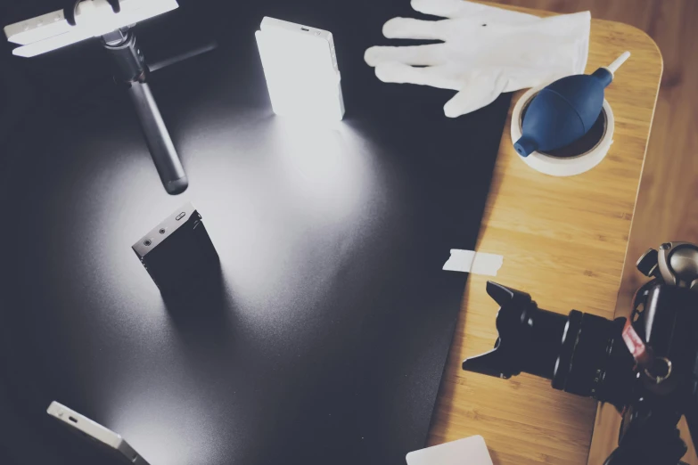 a pair of white gloves sitting on top of a table, a polaroid photo, unsplash, video art, magicavoxel cinematic lighting, black 3 d cuboid device, various posed, thumbnail