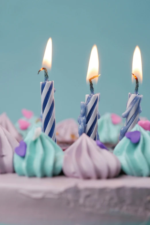 a close up of a cake with candles on it, a colorized photo, hyperrealism, purple blue color scheme, 3 d octane render 8 k, pastel goth aesthetic, birthday