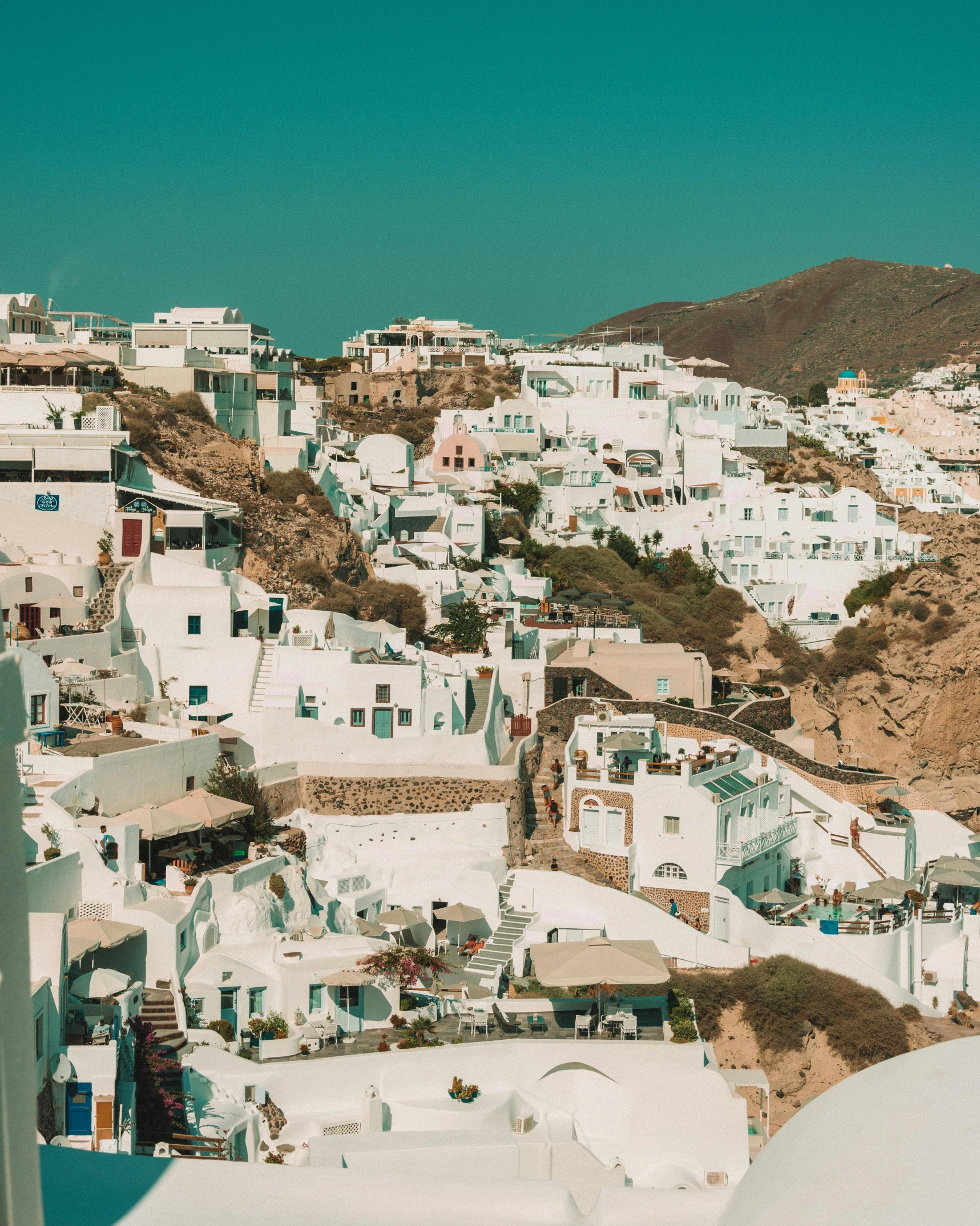 a view of a town from the top of a hill, pexels contest winner, neoclassicism, whitewashed buildings, cycladic! sculptural style, promo image, thumbnail