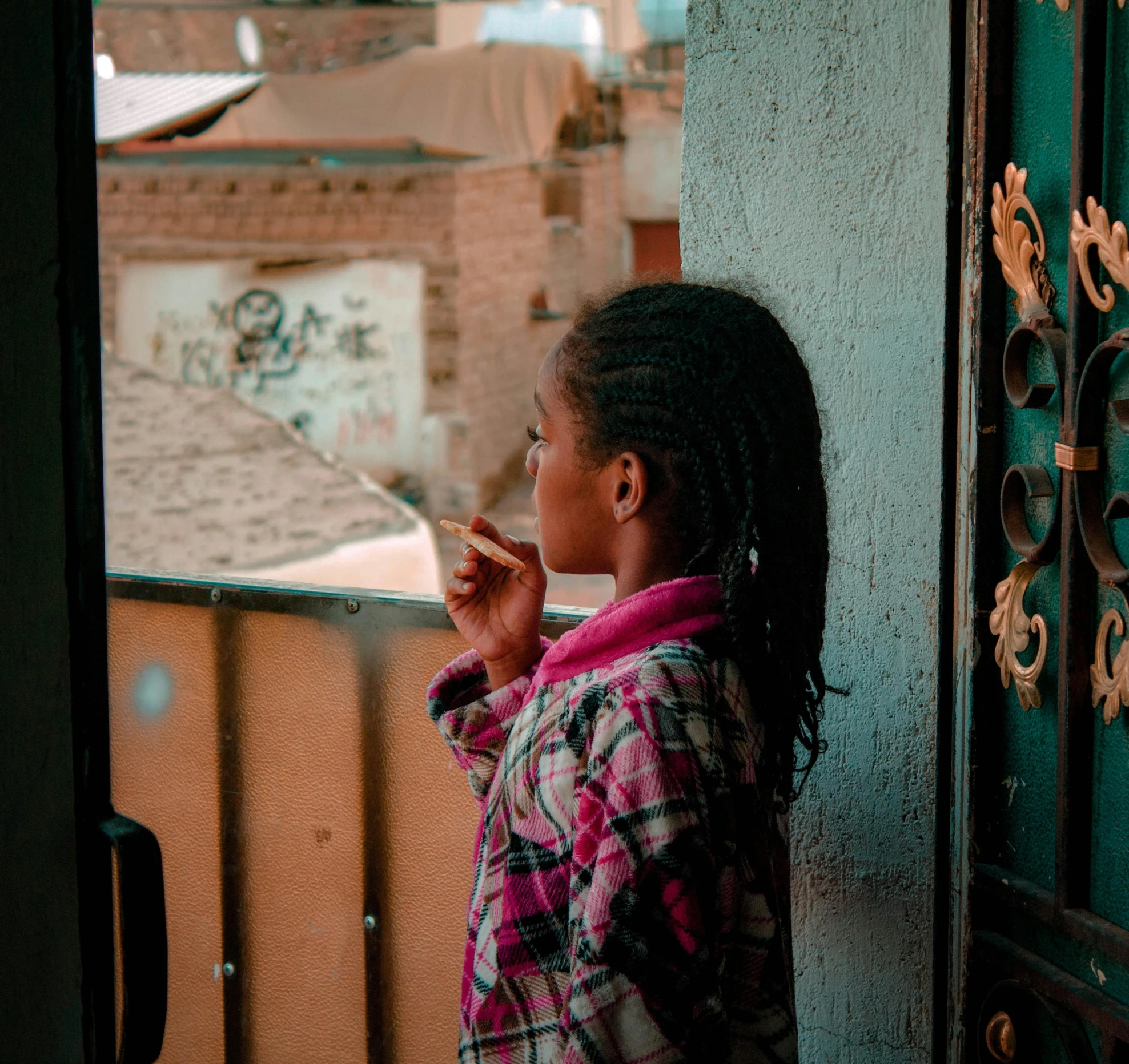 a young girl smoking a cigarette on a balcony, by Daniel Lieske, pexels contest winner, happening, nubian, looking from behind, about to enter doorframe, egyptian