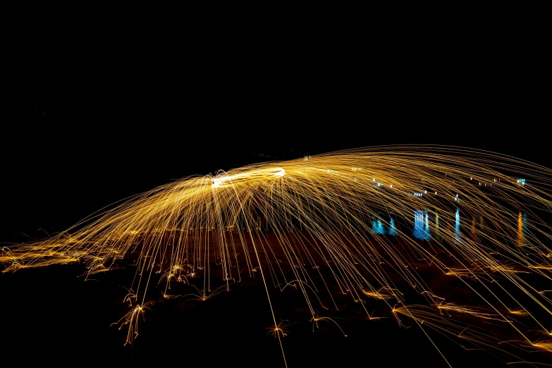 a long exposure photograph of a city at night, a stipple, by Jan Rustem, unsplash contest winner, light and space, large electrical gold sparks, fire poi, instagram post, gold