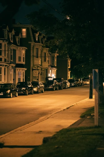 a street at night with cars parked on the side of the road, rhode island, fan favorite, victorian city, 2019 trending photo
