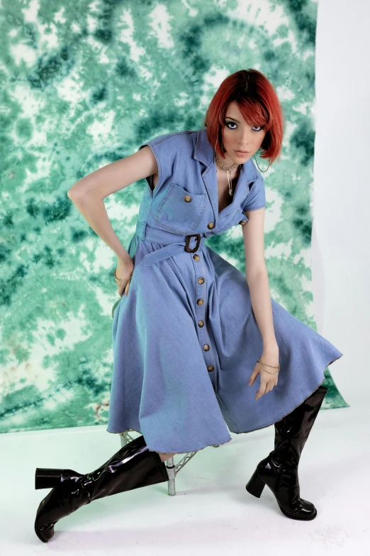 a woman in a blue dress and black boots, at a fashion shoot, leeloo outfit, promotional image, vintage clothing