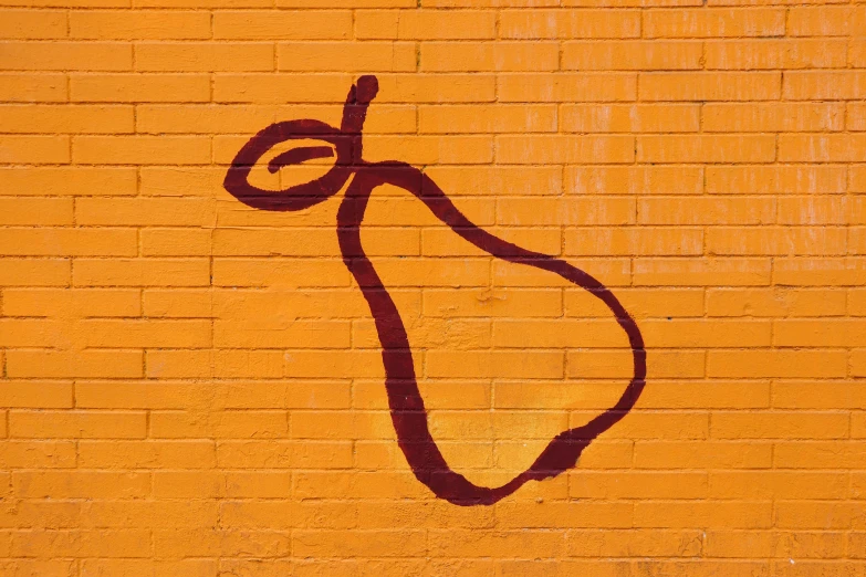 a painting of a pear on a yellow brick wall, inspired by Patrick Caulfield, trending on pexels, graffiti, dark orange, background image, stencil, demur