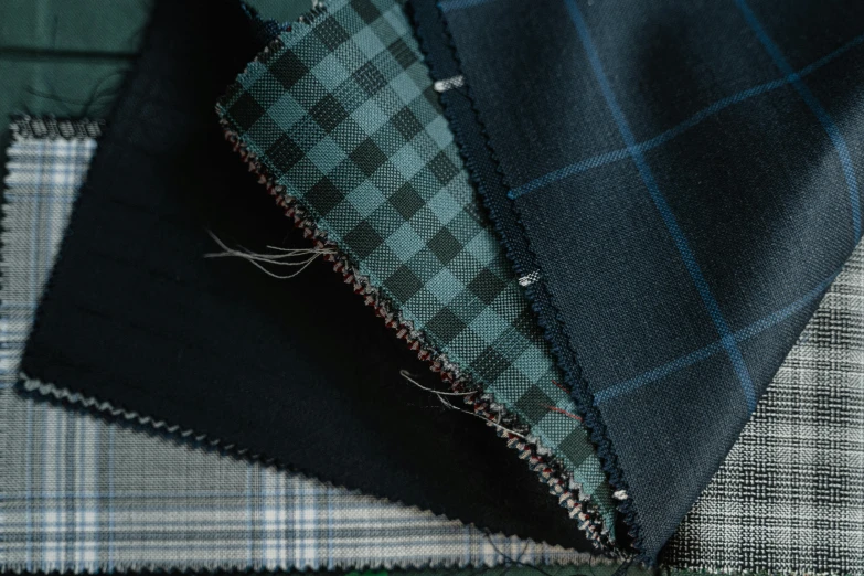 a couple of pieces of fabric laying on top of each other, a digital rendering, inspired by George Henry, unsplash, suits, zoomed out to show entire image, various styles, highly polished