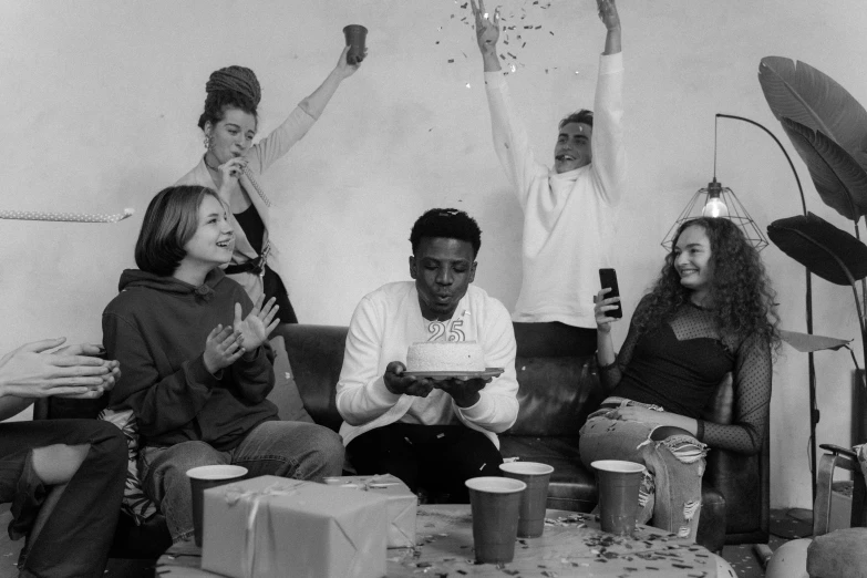 a group of people sitting on top of a couch, a black and white photo, by Emma Andijewska, pexels contest winner, realism, pals have a birthday party, black teenage boy, celebrate goal, rendering