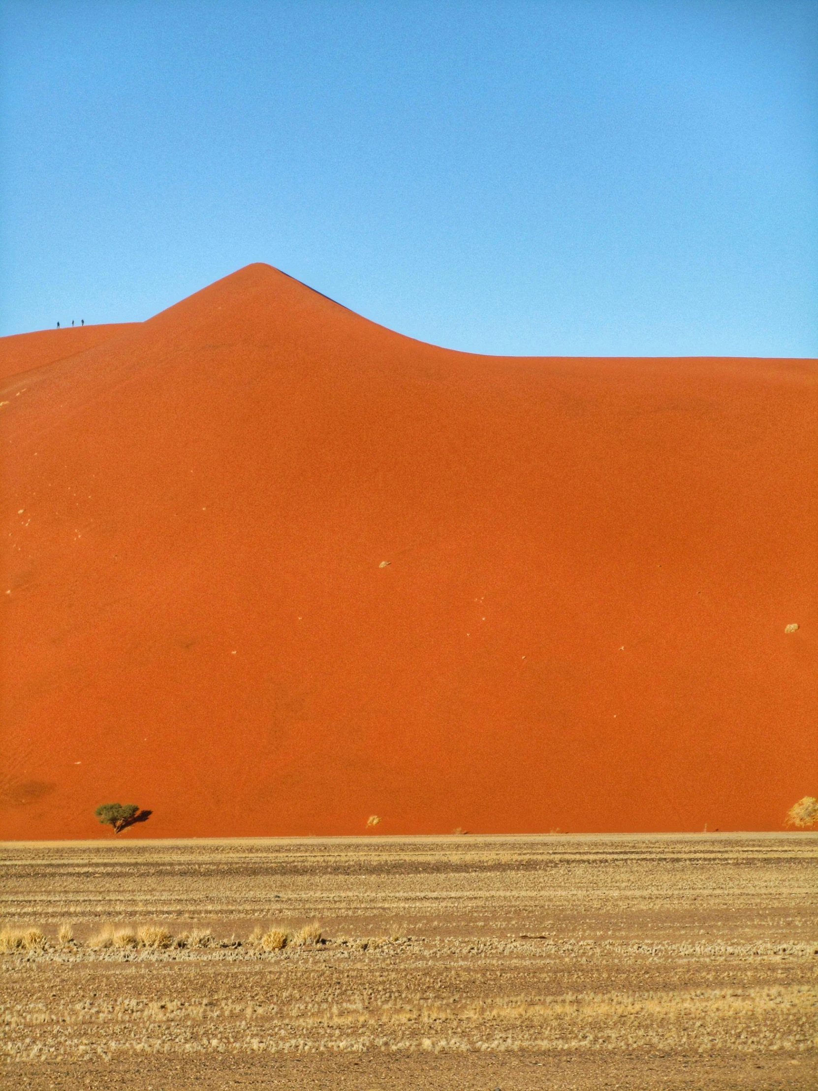 a large sand dune in the middle of a desert, inspired by Scarlett Hooft Graafland, pexels contest winner, seen from a distance, colour photograph, frans lanting, helio oiticica