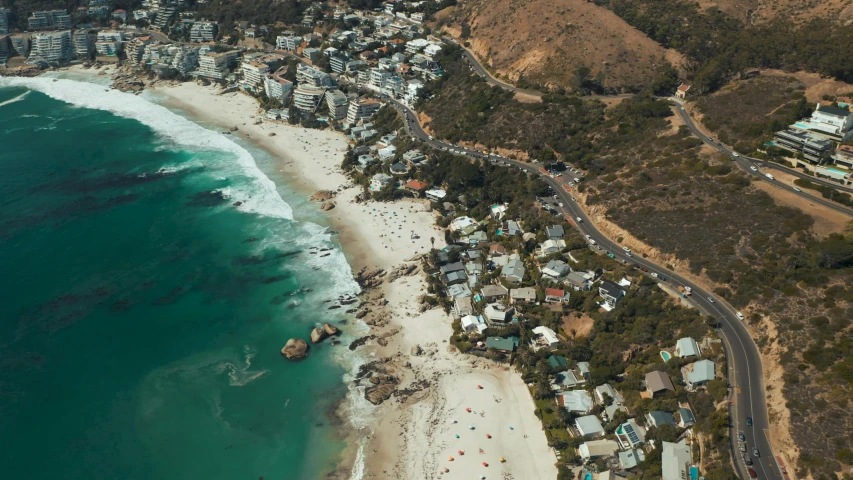 an aerial view of a beach and the ocean, by Daniel Lieske, pexels contest winner, renaissance, helicopter footage over city, cape, kimberly asstyn, settlement