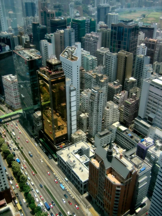 a large city filled with lots of tall buildings, inspired by Thomas Struth, pexels contest winner, square, ruan jian, golden cityscape, 8 k high resolution image