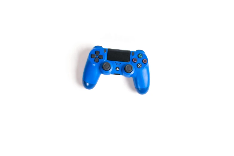 a close up of a game controller on a white surface, a picture, inspired by Yves Klein, 15081959 21121991 01012000 4k, medium blue, josh black, playstation 4