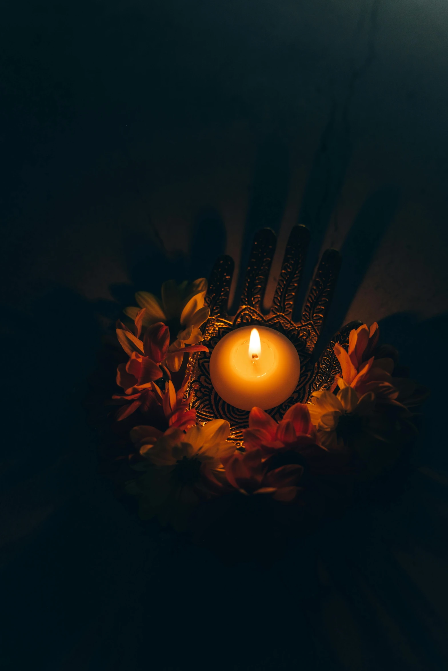 a candle that is lit in the dark, an album cover, pexels contest winner, hindu god, flowers around, halloween, avatar image