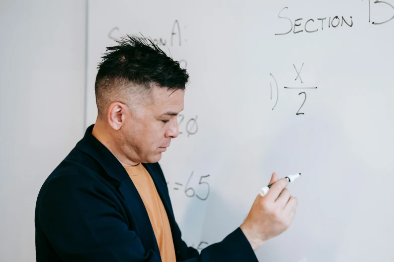 a man in a suit writing on a whiteboard, pexels contest winner, academic art, te pae, john picacio and brom, maths, 38 years old