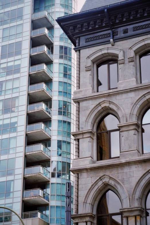 a couple of tall buildings next to each other, renaissance, montreal, steel window mullions, archways, trending photo