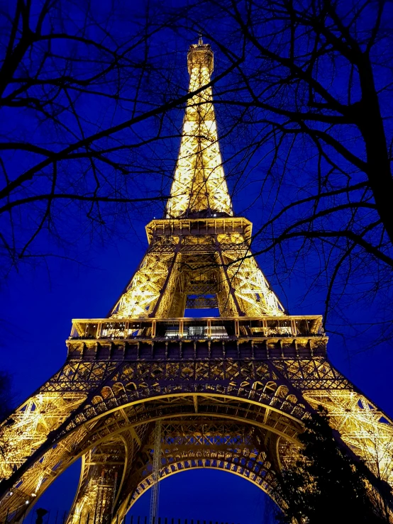 the eiffel tower lit up at night, slide show, stacked image