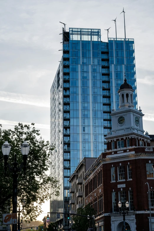 a tall building sitting in the middle of a city, new hampshire, slide show, mixed development, in savannah