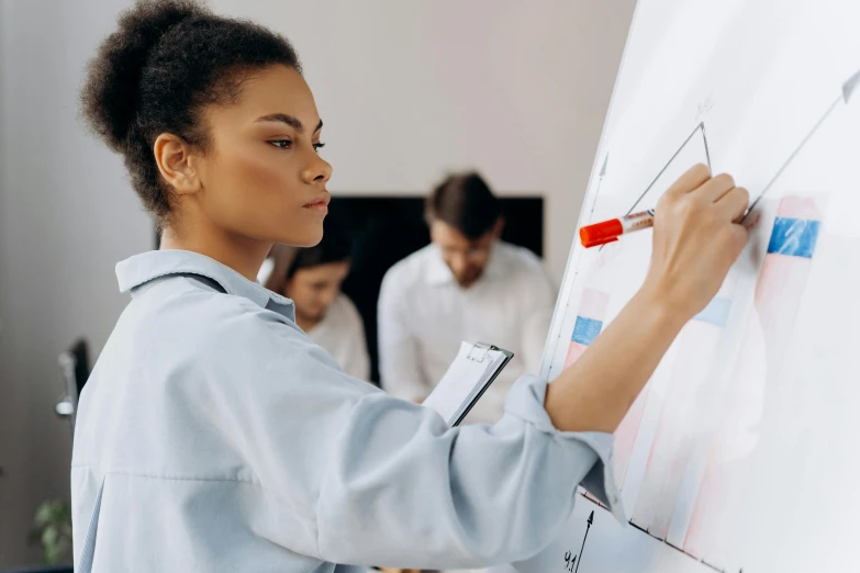 a woman writing on a white board with a marker, trending on pexels, analytical art, photo of a black woman, people at work, stunning graphics, chemistry